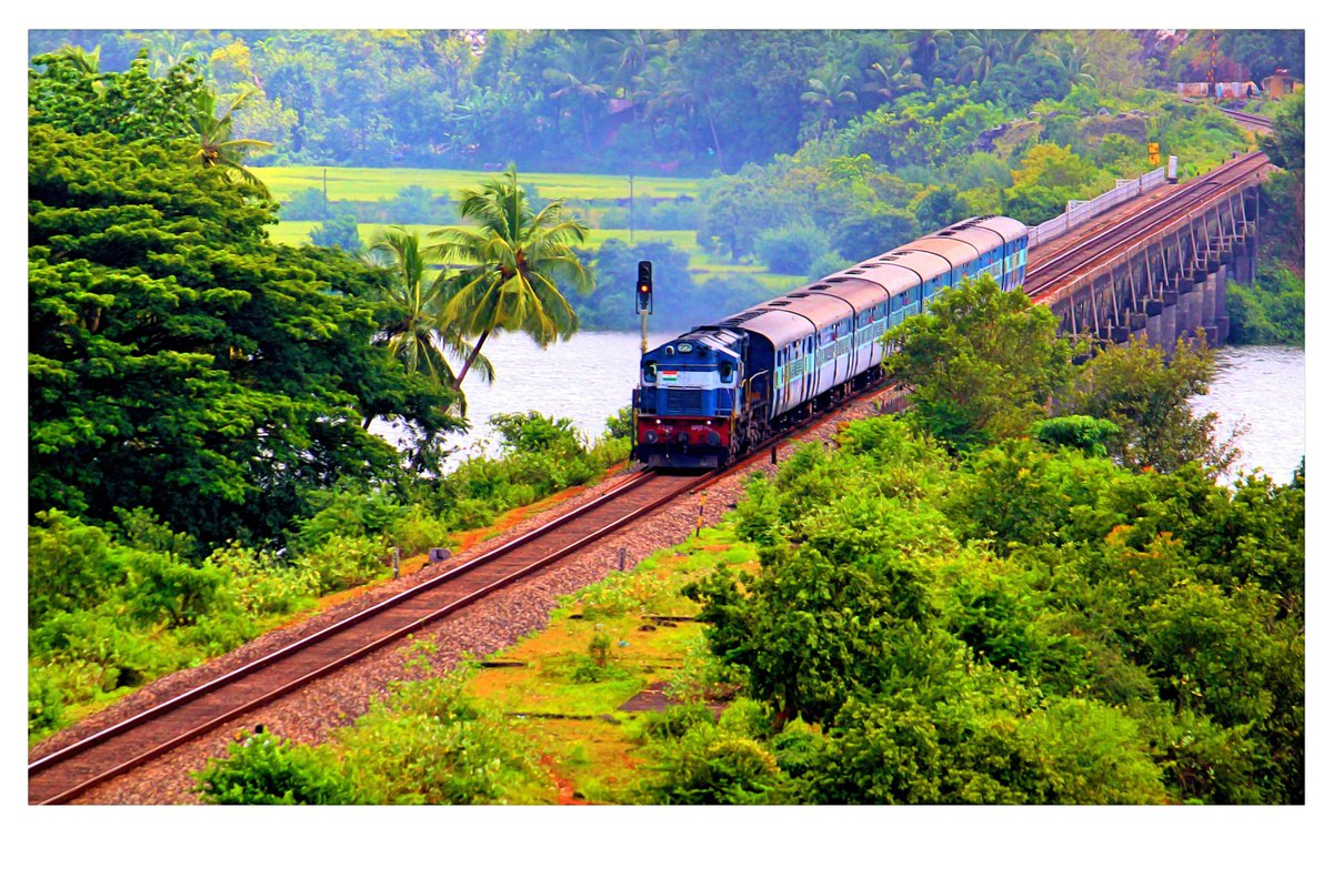 Konkan Railway travelling through lush coastal landscape